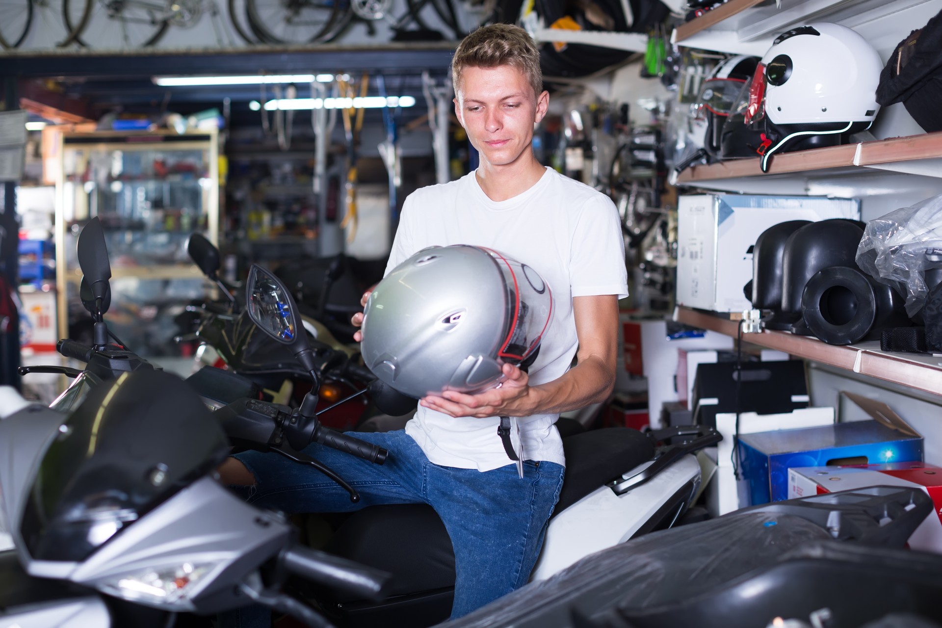 man sitting on the motorbike with helmet